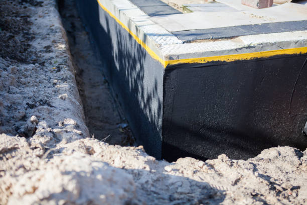 Professional Waterproofing technician working in Amityville, NY